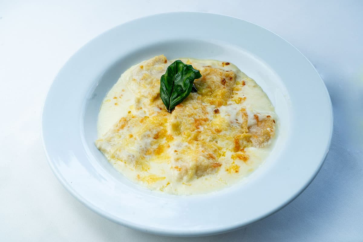 Ravioli di zucca alla panna mandorle